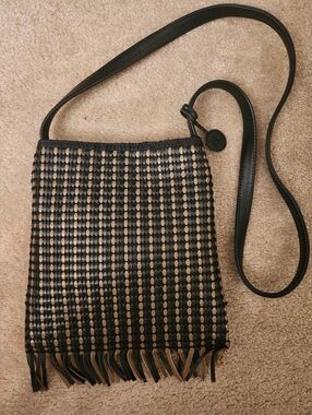 The SAK Black/Tan Woven Leather Fringe Crossbody Bag